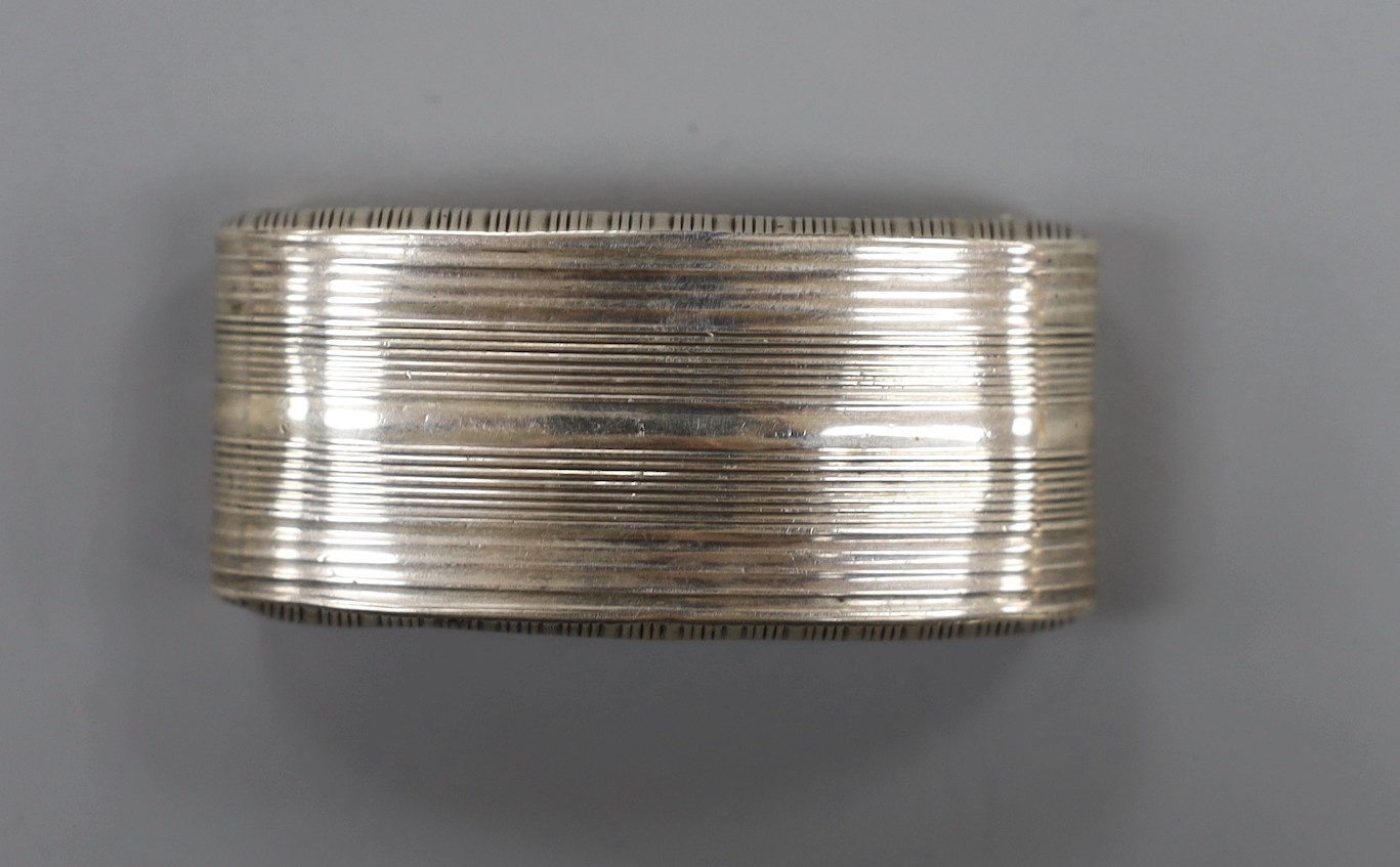 A George III silver concave snuff box, indistinct marks, maker John Linwood?, Birmingham, 18??, 65mm.